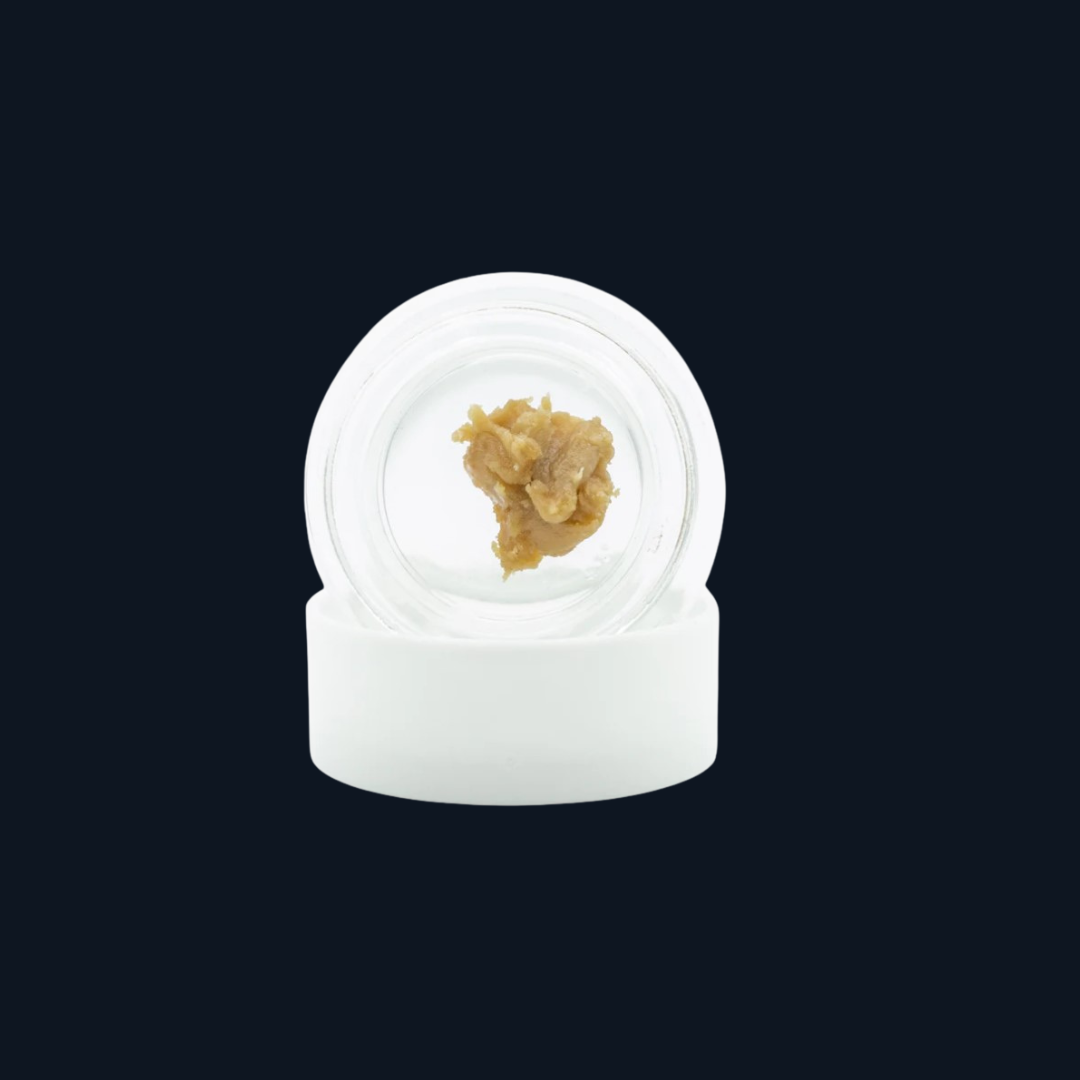A white lid and jar of Hashburger Rosin concentrate.
