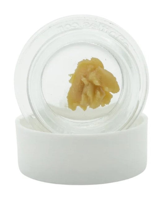 A white lid and clear jar with Motorbreath x Banana Punch concentrate.